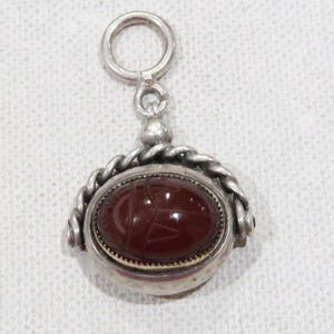 Victorian sterling silver watch fob with 10K gold carved carnealian scarab and black onyx