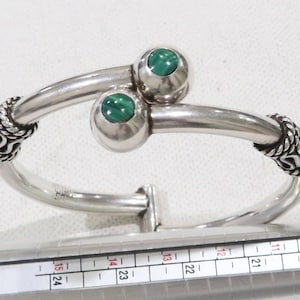 Stunning heavy sterling Taxco clamper style bracelet with tribal motifs and malachite endcaps