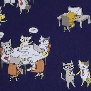 May include: A navy blue fabric with a repeating pattern of cats in various office settings. The cats are wearing clothes and using office supplies. The fabric is 5 cm wide.