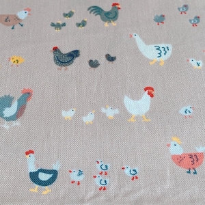May include: A beige fabric with a repeating pattern of chickens and chicks. The chickens are in various colours, including blue, green, red, and yellow. The chicks are all yellow. The fabric has a subtle texture.