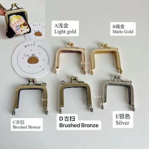 May include: Five different metal purse frames in various finishes: light gold, matte gold, brushed bronze, brushed bronze, and silver. The frames are all the same size and shape, with a rectangular opening and two small loops at the top.