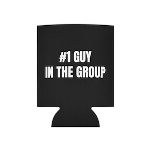 May include: Black beverage can cooler with the text "#1 GUY IN THE GROUP" in white. The cooler has a cutout at the bottom and is designed to keep drinks cold. A fun and functional accessory for any gathering.