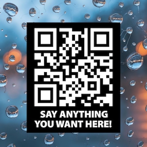 May include: A black and white QR code with the text "SAY ANYTHING YOU WANT HERE!" is displayed against a blurred background of water droplets. The QR code is a square with a complex pattern of black and white squares and rectangles.