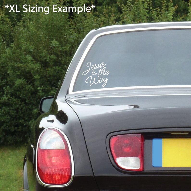 May include: A black car with a white vinyl decal on the back window that reads "Jesus is the Way".