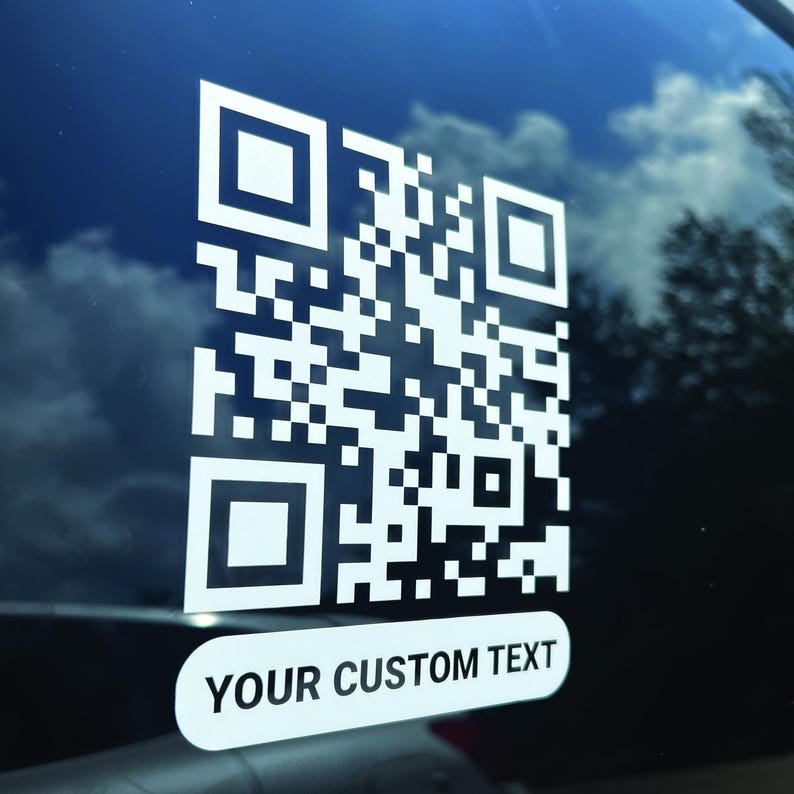 A white QR code decal showing" your custom text" in a bubble.