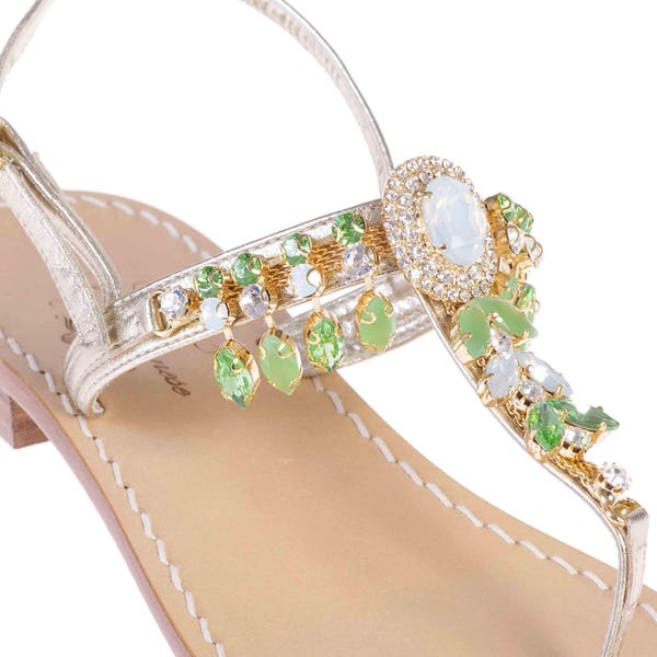MADE IN ITALY. The Domenica Sandal with Green and Opal Crystals is made with Platinum Leather in Italy!