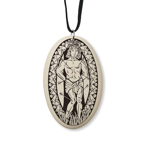 May include: A brown and white oval pendant necklace with a black cord. The pendant features a detailed illustration of a man with arrows piercing his body. The man is standing in a field of grass and surrounded by a decorative border of arrows.