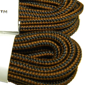 May include: Close-up of a pair of brown and black shoelaces. The laces are made of a woven material and have a textured look.