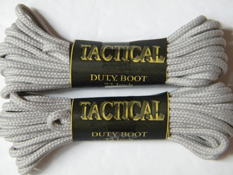 May include: Two spools of gray tactical duty boot laces, each labeled "Tactical Duty Boot 72 Inch"