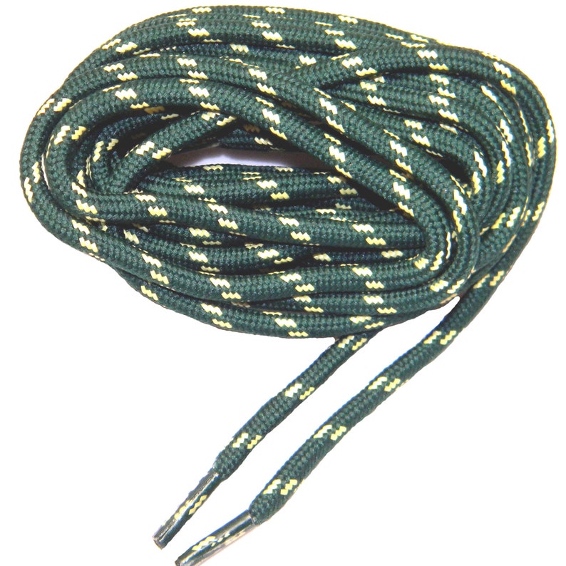 May include: A pair of green and yellow shoelaces with a striped pattern. The laces are coiled up and ready to be used.