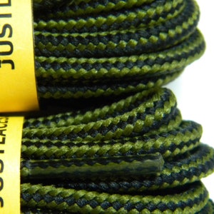 May include: Two spools of black and green shoelaces with the text "JUSTLACES" printed on the yellow spools.