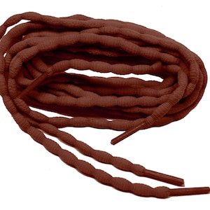 May include: A pair of brown shoelaces with a textured, rope-like design. The laces are coiled together and have a smooth, rounded tip.