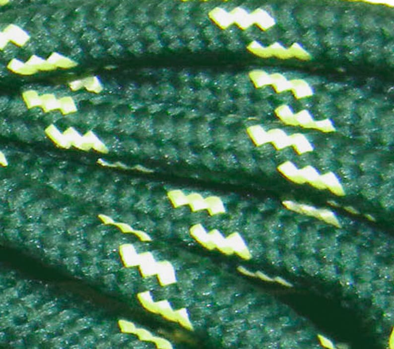May include: Green shoelaces with a white zig-zag pattern.