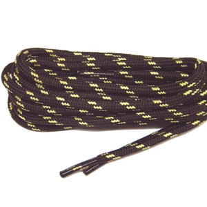 May include: Black shoelaces with a yellow stripe pattern. The laces are coiled and the ends are visible.