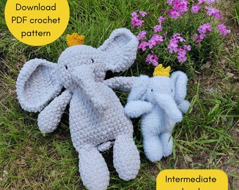 May include: Two crocheted elephant plushies, one large and gray, the other smaller and light blue, both wearing yellow crowns. The image includes text that reads "Instant Download PDF crochet pattern" and "Intermediate level". The elephants are on green grass.