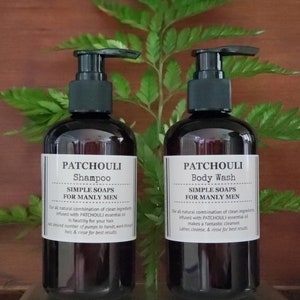 May include: Two brown plastic bottles with black pump tops. The bottles are labeled "Patchouli Shampoo Simple Soaps For Manly Men" and "Patchouli Body Wash Simple Soaps For Manly Men".