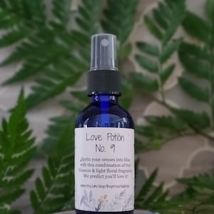 May include: A blue glass bottle with a black spray nozzle and a white label that reads "Love Potion No. 9". The label also includes the text "Spritz your senses into bliss with this combination of fruit blossom & light floral fragrance. We predict you'll love it! www.etsy.com/shop/theproverbialshop".