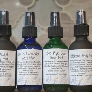 May include: Four glass body mist bottles with black spray tops. The bottles are labeled "HEALTH", "Citrus Lavender", "Bye Bye Bugs", and "Patchouli". Each label includes product information and the Etsy shop URL.