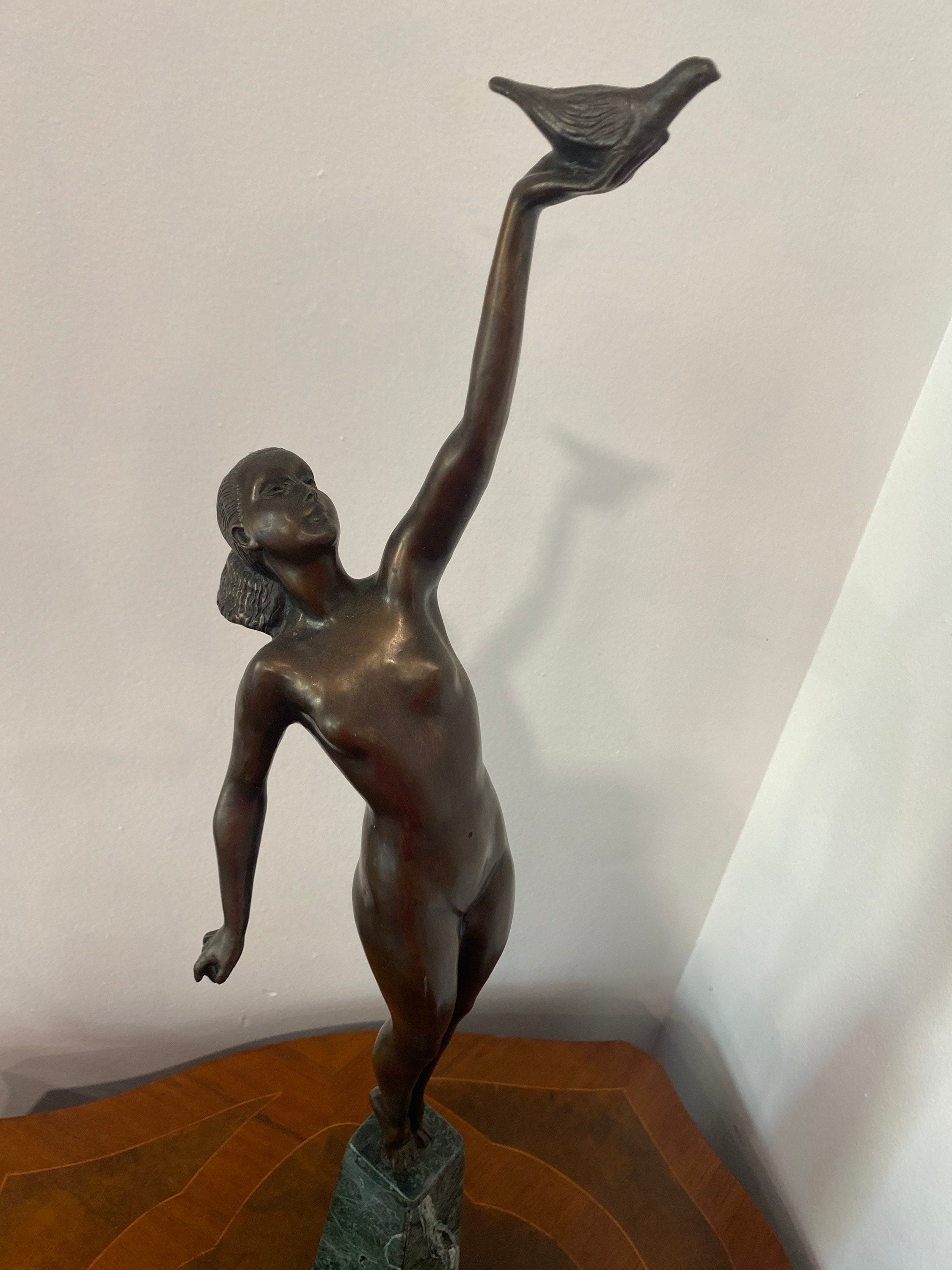 Art Deco Bronze Nude Sculpture of a Woman Holding a Bird 