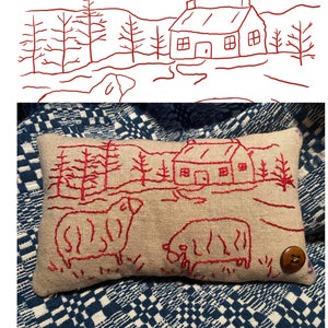 May include: A rectangular beige pillow with red embroidery featuring a cottage, sheep, and trees. The pillow has a brown button on the side. The text "Cottage Sheep Redwork Pattern" is above the pillow. The artist's name and year are at the bottom.