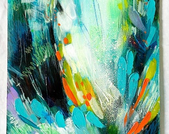 May include: Abstract painting with a white background and bright blue, green, orange, and yellow brushstrokes. The painting has a textured, layered look.