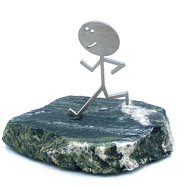 Runner gift for him.  A reminder that they are as tough as stone and steel.  Fits perfect on a desk.