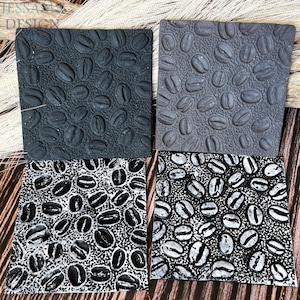 May include: Four square coasters with a coffee bean design. Two coasters are dark gray, one is light gray, and one is black and white. The coasters are made of a textured material and are arranged on a wooden surface.