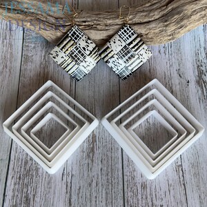 May include: Two diamond-shaped earrings featuring a black, white, and gold grid pattern with gold-tone hooks, accompanied by two sets of four nested white square-shaped cutters. The text JESSAMA DESIGN is visible in the upper left corner.