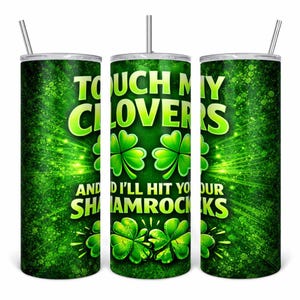 May include: A green tumbler with a stainless steel straw. The tumbler features the text "TOUCH MY CLOVERS AND I'LL HIT YOUR SHAMROCKS" in white and green, along with shamrock graphics. The background has a green, sparkly design.