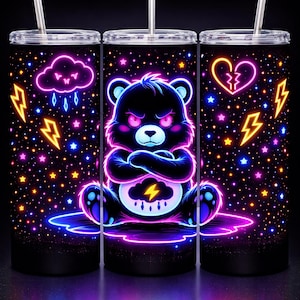 May include: Three black stainless steel tumblers with neon illustrations. One features a grumpy bear with a lightning bolt, another a cloud with rain, and the last a broken heart. Each has a silver straw and a starry background.