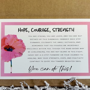 May include: Pink and white card with a watercolor poppy flower and the text "HOPE, COURAGE, STRENGTH" and "You can do this!"  The card has an inspirational message about strength, hope, and positivity.