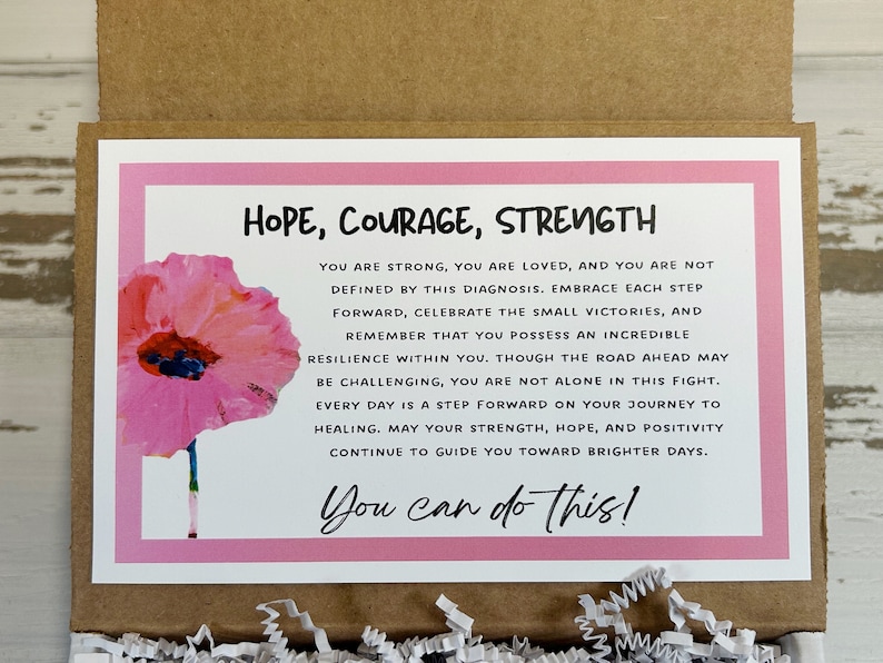 May include: Pink and white card with a watercolor poppy flower and the text "HOPE, COURAGE, STRENGTH" and "You can do this!"  The card has an inspirational message about strength, hope, and positivity.