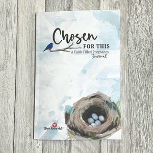 May include: A journal titled "Chosen FOR THIS" with a watercolor design. The cover features a blue bird on a branch, a bird's nest with eggs, and the text "A Faith-Filled Pregnancy Journal."