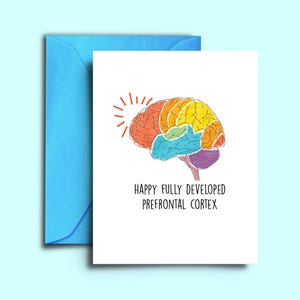 May include: A set of three ceramic mugs with a speckled, matte finish. The mugs are in shades of cream, light gray, and dark gray. Each mug has a simple, minimalist design, perfect for coffee or tea.