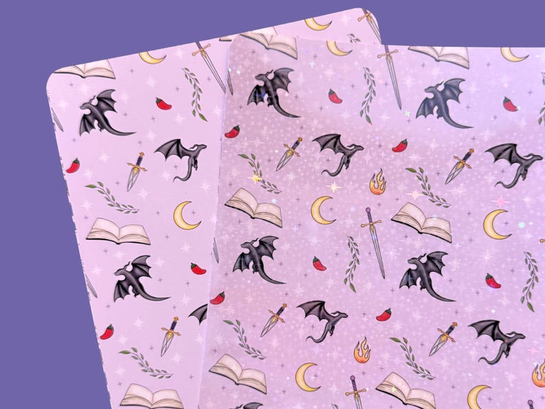 May include: Purple background with a repeating pattern of black dragons, swords, open books, and crescent moons. The pattern is printed on two sheets of clear vinyl.
