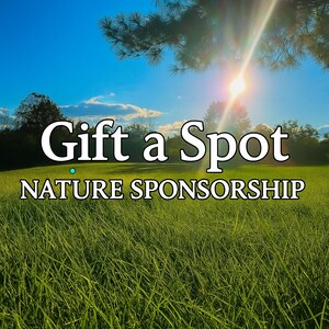 May include: A sunny outdoor scene with the text "Gift a Spot" and "Nature Sponsorship" in white. The image features a bright blue sky, a green field, and a sunburst effect.