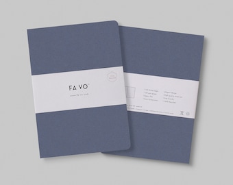 May include: A blue notebook with the text "FAVO" and the website "www.favo.com" printed on the front cover. The back cover has information about the notebook, including the fact that it is 100% recycled.