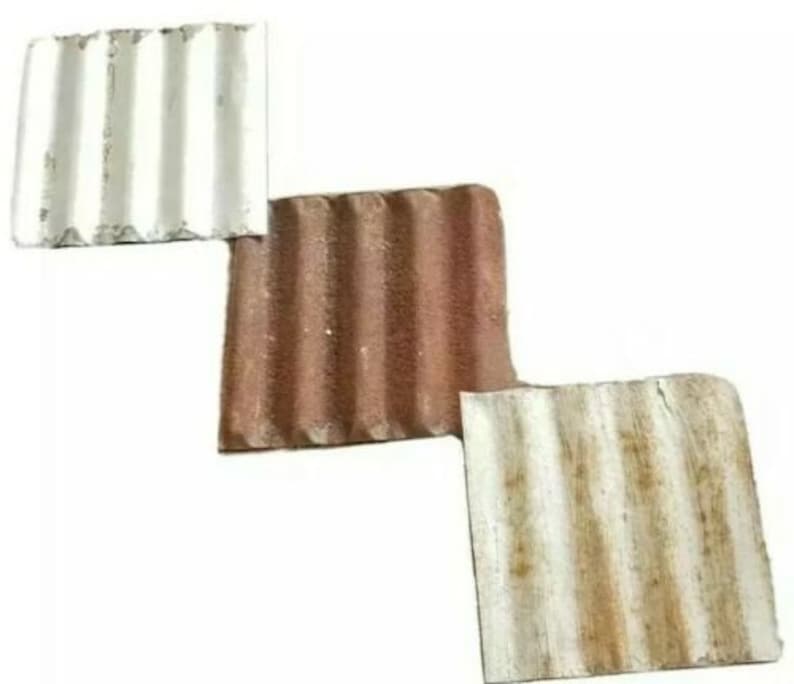 May include: Three corrugated roof tiles, one white, one brown, and one white with brown rust stains.