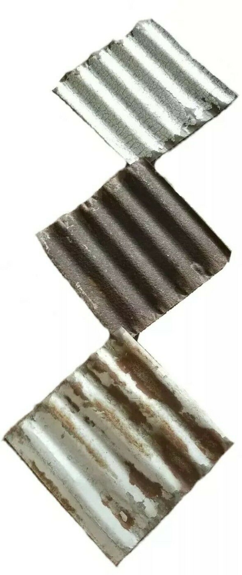 May include: Three diamond-shaped pieces of corrugated metal with a rustic, weathered look. The metal is painted in shades of white, gray, and brown, with some rust showing through.