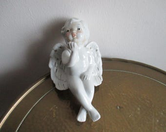 Putti vintage, querubín, ángel sentado, taburete de borde, porcelana