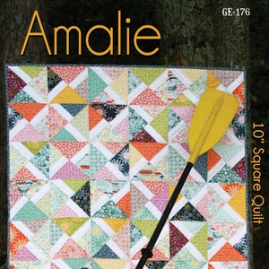 May include: A colorful quilt pattern with a geometric design of triangles in shades of pink, orange, green, blue, and yellow. The quilt is 10 inches square and is called "Amalie".
