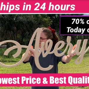 May include: A wooden sign with the name "Avery" written in a cursive font. The sign is held by a person in front of a green grassy background. The text "Ships in 24 hours" and "70% off Today only" is visible at the top of the image. The text "Lowest Price & Best Quality" is visible at the bottom of the image.