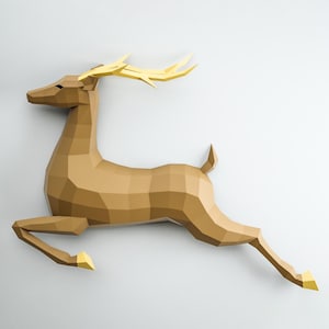 May include: A brown papercraft deer with gold antlers, leaping in mid-air. The deer is made of folded paper and has a realistic, three-dimensional appearance.