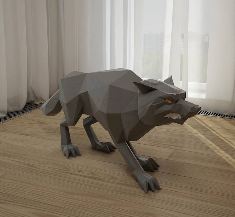 May include: A gray origami wolf sculpture with a snarling expression and glowing yellow eyes. The wolf is standing on a wooden floor.