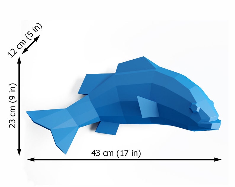 May include: A blue origami fish sculpture with a geometric design. The fish is 17 inches long, 9 inches tall, and 5 inches wide.