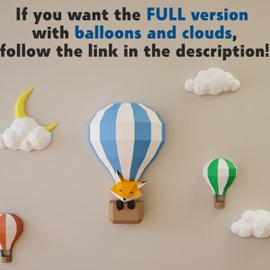 May include: A wall decorated with paper craft decorations, including a blue and white striped hot air balloon with a fox inside, a green and white striped hot air balloon, an orange and white striped hot air balloon, a white cloud, and a yellow crescent moon.