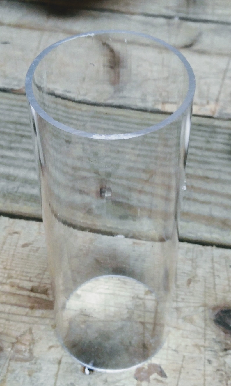 May include: A clear plastic tube, possibly for crafts or DIY projects.