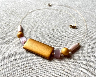 short necklace of wood and cat's eye glass, Solaris