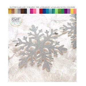 May include: Silver glitter snowflake garland. The garland is pre-assembled and features 9 shapes. The image includes the text "GLITTER GARLAND | 9 SHAPES | PRE-ASSEMBLED | AVAILABLE IN 22+ COLOURS" and the "RSVP PARTY DECOR" logo.