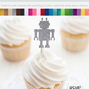 May include: Silver glitter robot cupcake topper. The robot is standing on a stick and is ready to be placed on a cupcake. The cupcake topper is sold in a set and is available in a variety of colors.